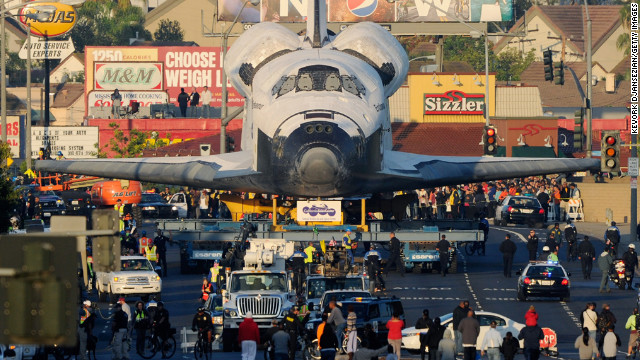 October 12: Space Shuttle Endeavour is transported to The Forum arena for a stopover and celebration in Inglewood, California. The space shuttle was on 12-mile journey from the Los Angeles International Airport to the California Science Center to go on permanent public display. 