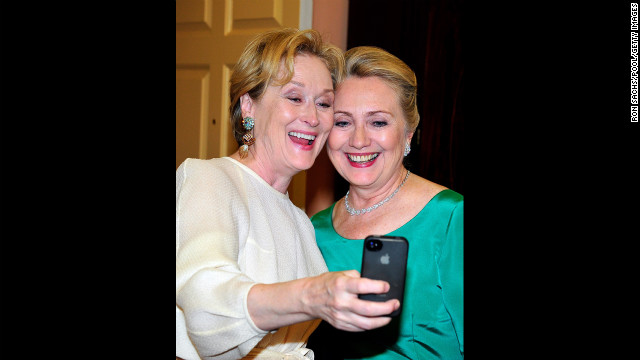 Meryl Streep snaps a picture with U.S. Secretary of State Hillary Clinton after a dinner for Kennedy Center honorees that Clinton hosted at the State Department in Washington on Saturday, December 1. The 2012 honorees include blues musician Buddy Guy, actor Dustin Hoffman, late-night talk-show host David Letterman, dancer Natalia Makarova, and the surviving members of British rock band Led Zeppelin -- Robert Plant, Jimmy Page and John Paul Jones. An awards ceremony recognized the artists' lifetime achievements to American culture on Sunday, December 2, at the Kennedy Center. Streep was a recipient last year.