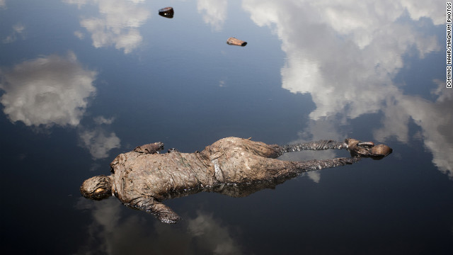 April 17: A Sudan Armed Forces soldier lies dead in a pool of oil next to a leaking oil facility. He had engaged in heavy fighting with Sudan People's Liberation Army troops from South Sudan.