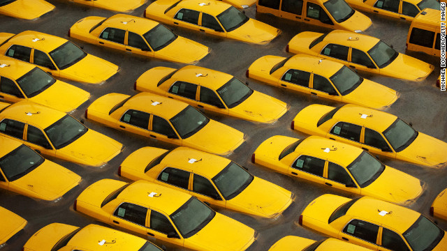 October 30: Taxis sit in a flooded lot in Hoboken, New Jersey, after Superstorm Sandy devastated the region. The storm slammed ashore near Atlantic City, New Jersey, after forming in the Caribbean and sweeping northward, killing 182 people from Haiti to Canada.