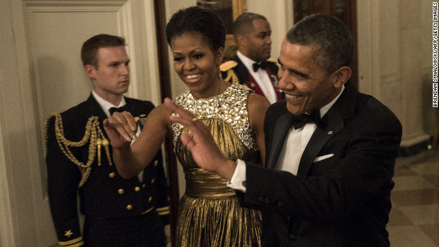 The Obamas arrive for the pre-honors reception Sunday at the East Room of the White House.