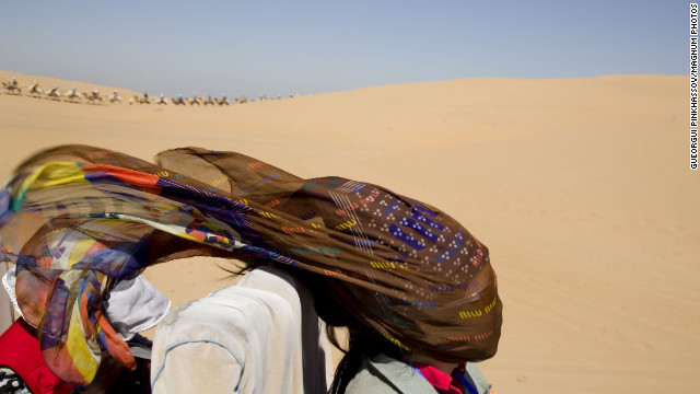 August 21: A woman rides through the Gobi Desert in Mongolia.