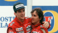 Brazilian new formula one champion Ayrton Senna (L) embraces his teammate and winner of today Adelaide Australian Grand Prix French driver Alain Prost on the podium 18 November 1988. 