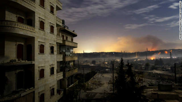 Smoke rises in the Hanano and Bustan al-Basha districts in Aleppo on December 1 as fighting continues through the night.