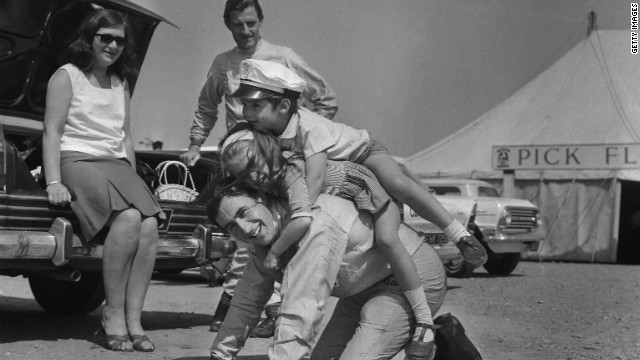 Former world champion Jackie Stewart, seen here playing with the children of F1 rival Graham Hill, was remarkably friendly with his peers, Tu says. "He was incredibly fond of a number of people who drove with him. That partly is because there was a clearer distinction of him being a number one and them being number two drivers."