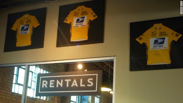 Three of Armstrong's yellow jersey hang inside Mellow Johnny's.