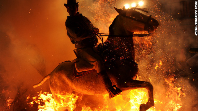 January 16: A man rides a horse through a bonfire in the small village of San Bartolome de Pinares, Spain, in honor of San Anton, the patron saint of animals.