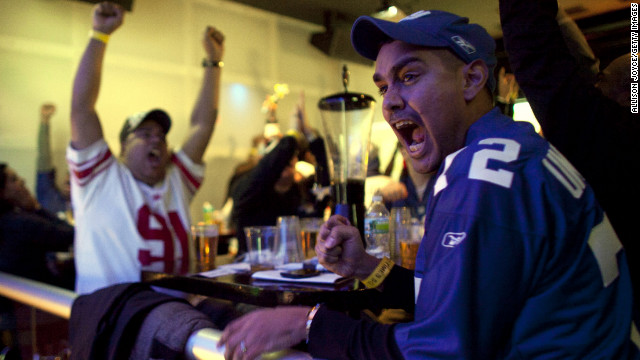 February 5: Football fans watch the New York Giants take on the New England Patriots in Super Bowl XLVI at Tonic Bar in New York. The Giants defeated the Patriots 21-17.