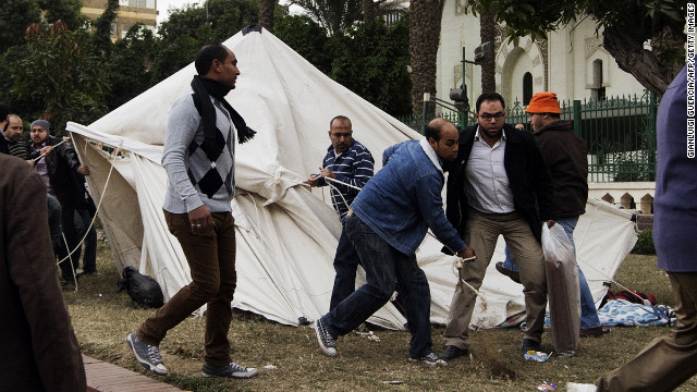 Members of the Muslim Brotherhood and Morsy supporters destroy tents of anti-Morsy protesters outside the presidential palace on December 5.