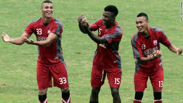 Mendieta (left) celebrates with Persis Solo teammates Romuald Noah and Yanuar Ruspuspito after scoring in a match against Persip Pekalongan.