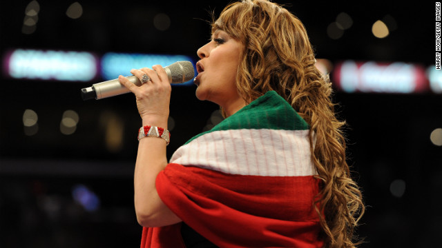 Rivera takes on the Mexican national anthem before the junior middleweight bout between Shane Mosley and Sergio Mora in September 2010 at the Staples Center in Los Angeles.