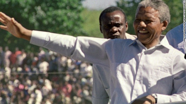Mandela and Zambian President Kenneth Kaunda arrive at an ANC rally on March 3, 1990, in Lusaka, Zambia. Mandela was elected president of the ANC the next year.