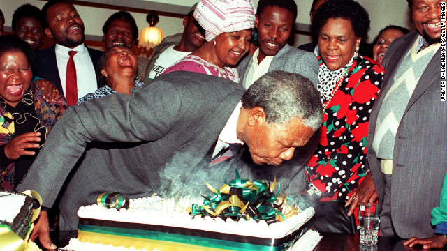 At his Soweto home on July 18, 1990, Mandela blows out the candles on his 72nd birthday cake. It was the first birthday he celebrated as a free man since the 1960s.