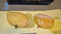 A woman was arrested in the El Prat airport in Spain for carrying cocaine in her breast implants.