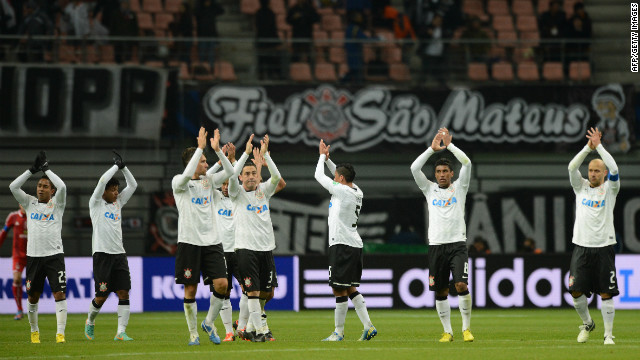 After the 1-0 semifinal win over Ah-Ahly, the Corinthians players applaud their travelling fans in the Toyota stadium