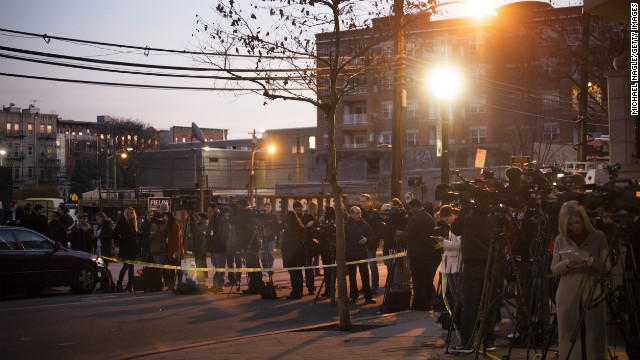 Members of the media converge on December 14 in front of an apartment at 1313 Grand Street in Hoboken, New Jersey. The apartment is believed to be connected to the Connecticut elementary school shooting.