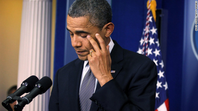 U.S. President Barack Obama wipes tears as he makes a statement in response to the elementary school shooting in Connecticut on December 14.
