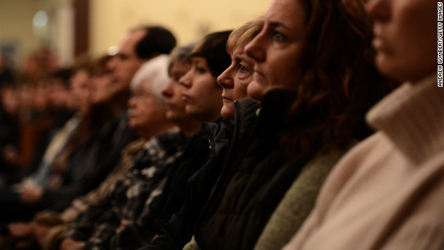 People gather in the St. Rose Church during a service on December 14.
