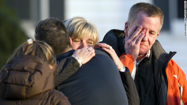 Distraught people leave the fire station after hearing news of their loved ones from officials on Friday.