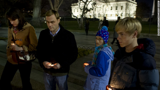 People gather for a vigil outside the White House in Washington following the Connecticut elementary school shooting on December 14.