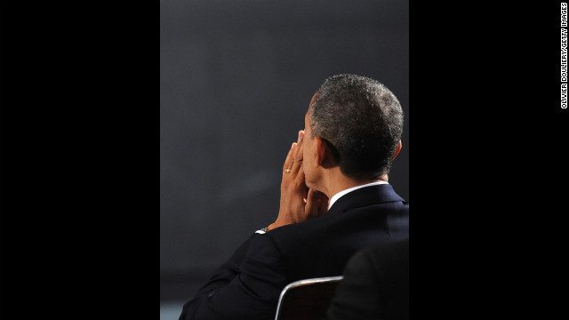 President Barack Obama waits to speak at an interfaith vigil for the shooting victims from Sandy Hook Elementary School December 16 at Newtown High School.