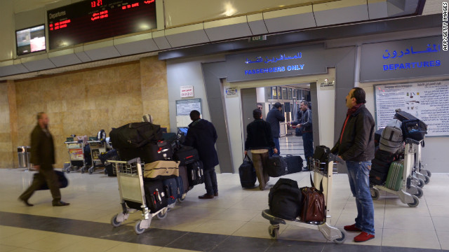 Passengers gather at a terminal at the airport in Aleppo, Syria, on Wednesday, December 12.