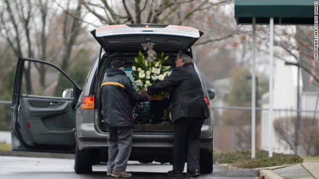 A florist delivers bouquets for Noah Pozner's funeral on December 17 in Fairfield.