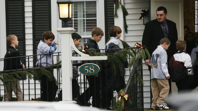 Boys enter Honan Funeral Home before Jack Pinto's funeral on December 17 in Newtown.