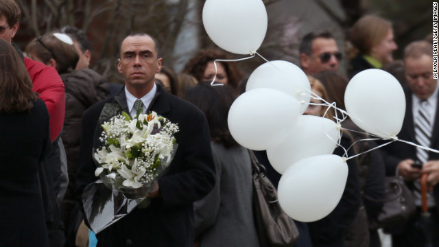 People arrive at the funeral home ahead of Noah Pozner's service on December 17.