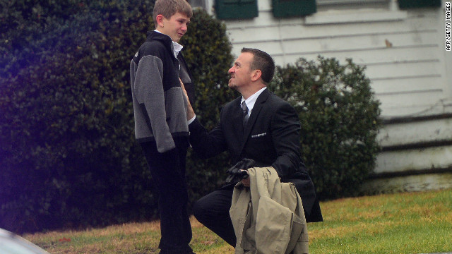 A man comforts a young boy after the funeral for Jack Pinto, 6, one of the children killed when Adam Lanza stormed their elementary school and claimed the lives of 20 children and six adults after killing his mother. Lanza turned the gun on himself as police closed in. 