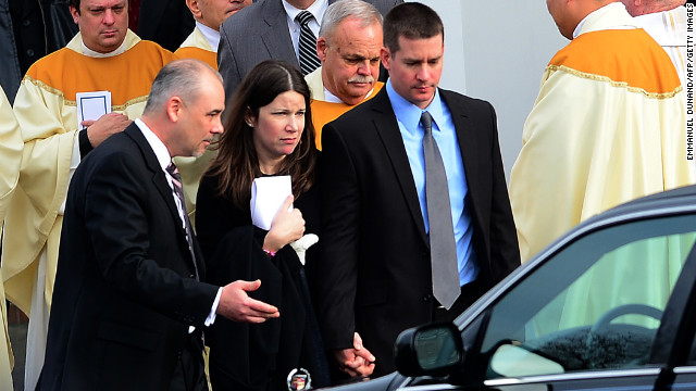 Richard and Krista Rekos leave after a funeral service for their 6-year-old daughter, Jessica, at Saint Rose of Lima Church on Tuesday, December 18, in Newtown. Jessica was one of 20 children killed in last week's school shooting.