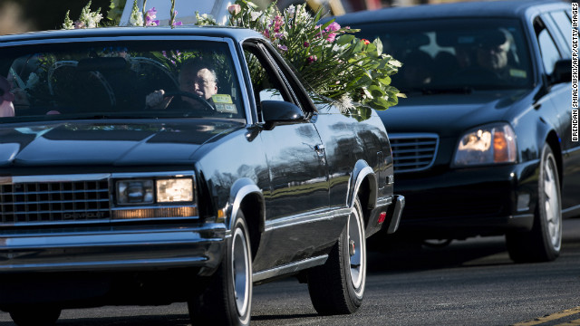 A procession arrives for the funeral of Victoria Soto, 27, at Lordship Community Church in Stratford, Connecticut, on December 19. Soto was a first-grade teacher being hailed as a hero for protecting the children in her class during last week's school massacre in Newtown.