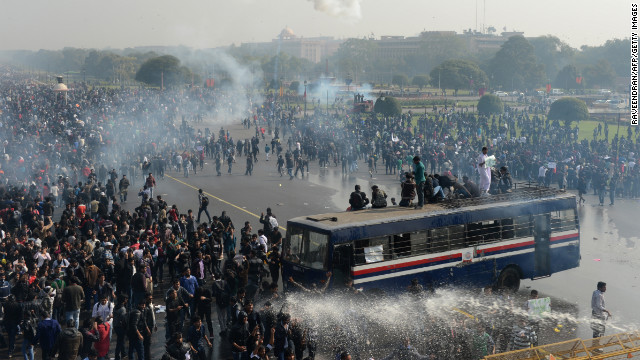 Police spray water and fire tear gas towards demonstrators on December 22.