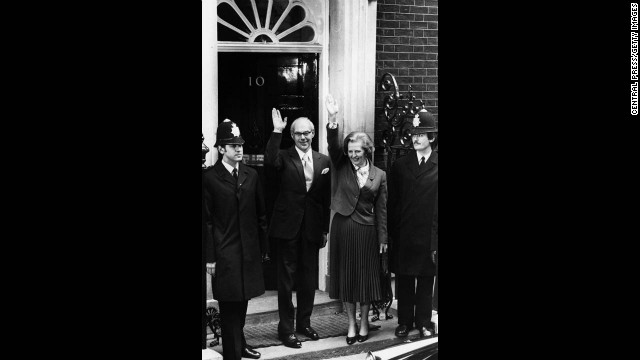 Thatcher, becoming the first female prime minister of a European country, stands with her husband, Denis, outside 10 Downing Street in May 1979 after her party's success in the general election.