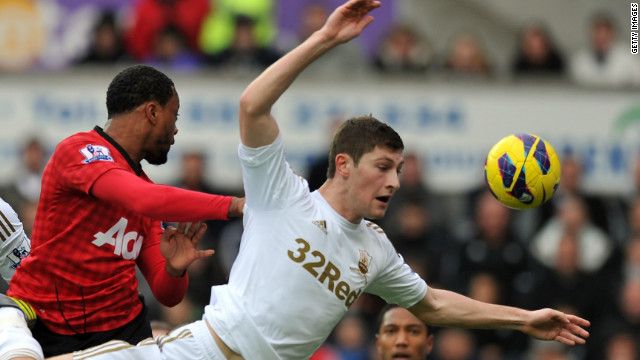 Patrice Evra gave Manchester United a 16th minute lead at Swansea after heading home Robin van Persie's corner.