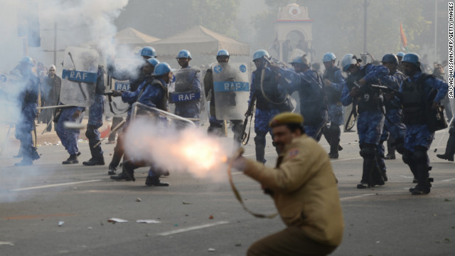 Police fire tear gas on Sunday, December 23, during a protest calling for better safety for women following last week's rape. Thousands of protesters defied a ban on demonstrations in New Delhi on Sunday, venting their anger over the incident.