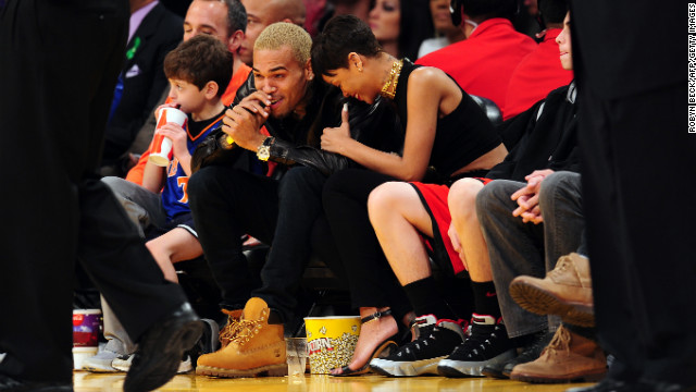 Rihanna and Chris Brown attended an NBA game bin Los Angeles, California, on Christmas Day 2012.