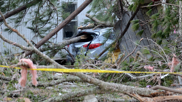 The storm winds knocked down trees, destorying cars and homes near Troy, Alabama, on December 26.