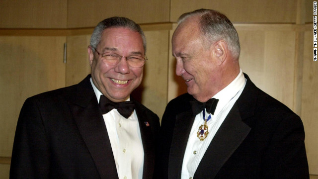 U.S. Secretary of State Colin Powell talks with Schwarzkopf on December 6, 2002, during a receptionbefore the American Patriot Award Dinner in Washington. The dinner honored former U.S. President George H. W. Bush.