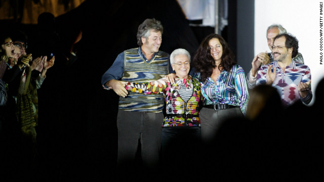 From left: Vittorio, Rosita (his mother), Angela (his sister), Ottavio (his father) and Luca (his brother) acknowledge applause on the catwalk at the end of the Missoni collection during the last day of Milan's 2004 spring/summer fashion week on October 5, 2003. The show marked 50 years since the company was founded by Ottavio (nicknamed "Tai ") and Rosita and 50 years since they married. Vittorio Missoni and his siblings took over the brand in 1996.