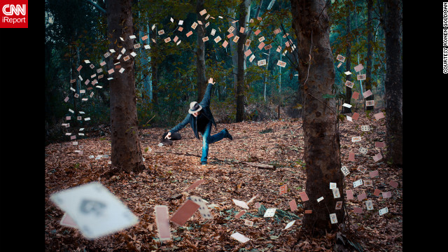"I started out by shooting the magician using two flashes, one coming from the top and one from below," Goldman said. He and his friend then plotted out the spiral of cards, with each man holding four cards at a time. The cards were lit by the ambient light of the forest. A third man was at the camera, pressing the button each time a new card position was ready. The end result is a composite of dozens of images.