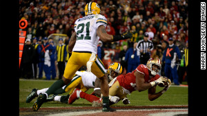 Wide receiver Michael Crabtree of the San Francisco 49ers catches a touchdown pass during the NFC Divisional Playoff Game at Candlestick Park January 12.