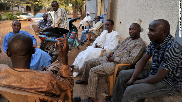 Internally displaced Malians from Timbuktu chat at a makeshift cafe in Bamako on Sunday.