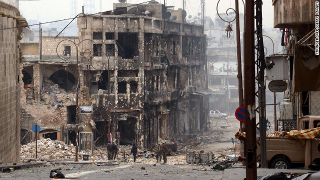 Syrian government troops take position in a heavily damaged area in Aleppo on Saturday, January 12. 