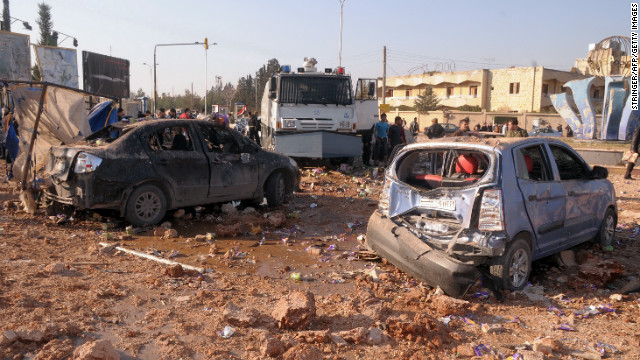 Damaged vehicles sit between dormitories and the architecture facility at Aleppo University, following an explosion on Tuesday, January 15. A monitoring group reported deaths and dozens of injuries. 