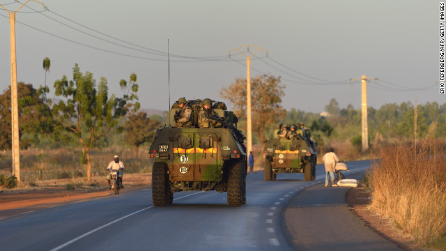 French army soldiers stand on armoured vehicles as they leave Bamako and start their deployment to the north of Mali as part of the Serval operation on Tuesday, January 15. 