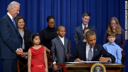 130116122807-obama-signing-0116-c1-main.jpg