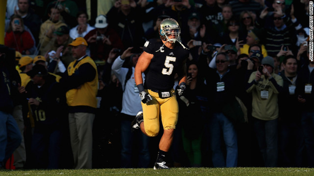 Te'o takes the field as part of senior introductions before a game against the Wake Forest Demon Deacons at Notre Dame Stadium on November 17, 2012.