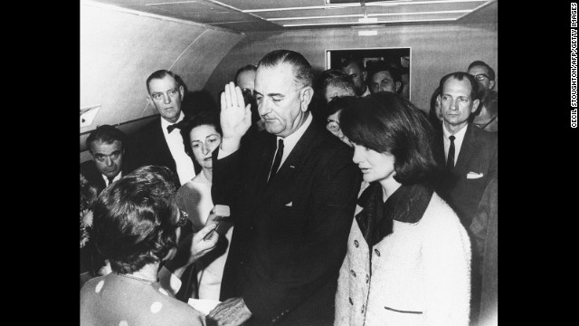 Lyndon B. Johnson takes the oath of office on November 22, 1963, after the assassination of President John F. Kennedy. Kennedy's widow, Jacqueline, stands at Johnson's side. U.S. District Judge Sarah T. Hughes swore in Johnson on Air Force One.