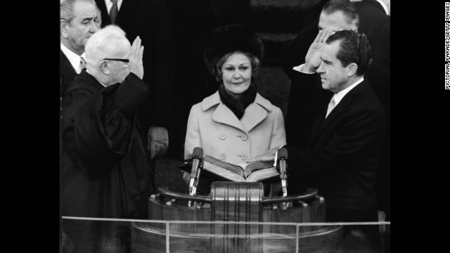 Richard Nixon takes the oath of office as he is sworn in as the 37th president of the United States on January 20, 1969.